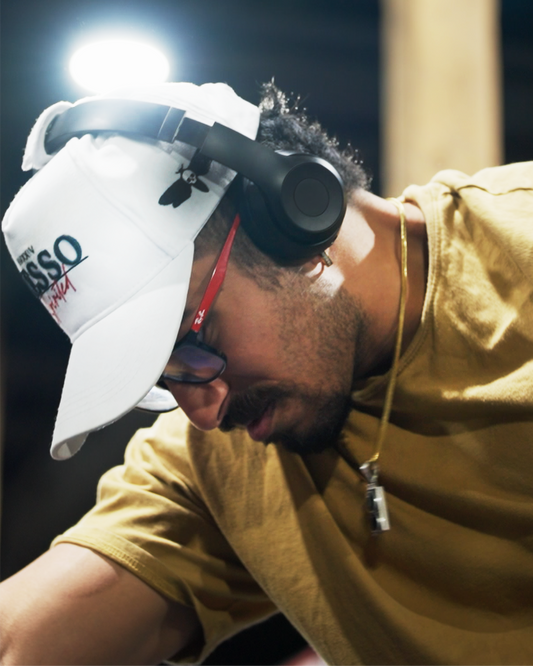 Athlete wearing Nesso hat with secure headphones during a workout, showcasing innovative design for training.