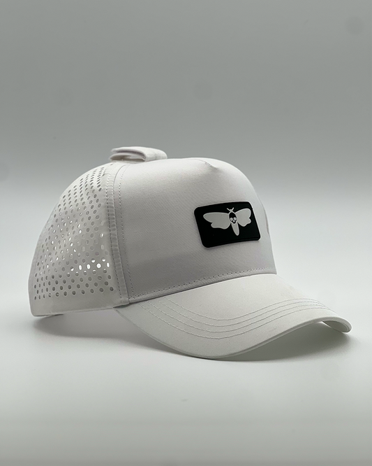 Nesso Operator Series breathable hat with perforated backing, designed to secure headphones and keep you cool during intense workouts.