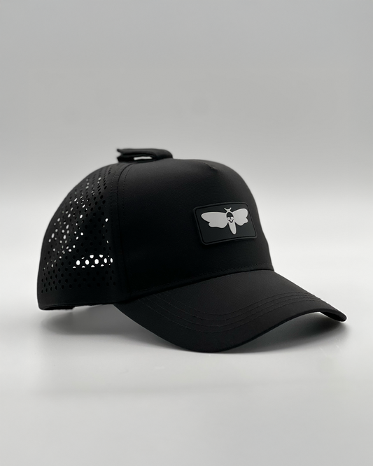 Nesso Operator Series breathable hat with perforated backing, designed to secure headphones and keep you cool during intense workouts.
